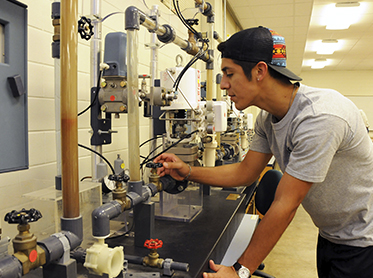 Male Process Technology student in laboratory.